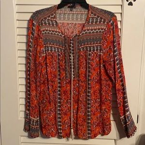 Long sleeve shirt. It’s more of a pink in person.